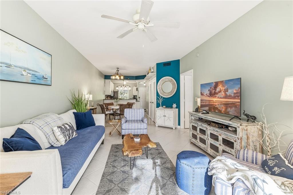 Undisclosed Address Naples, FL 34113 - Photo 12 of 24 a living room with furniture and a flat screen tv