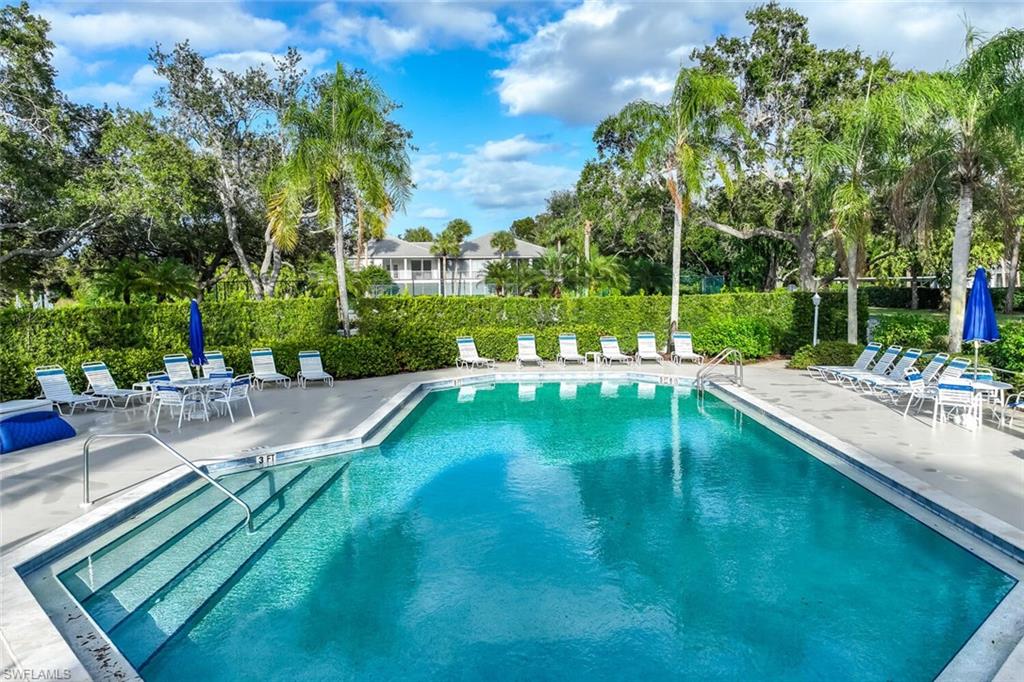 Undisclosed Address Naples, FL 34113 - Photo 19 of 24 a view of a lake with a yard