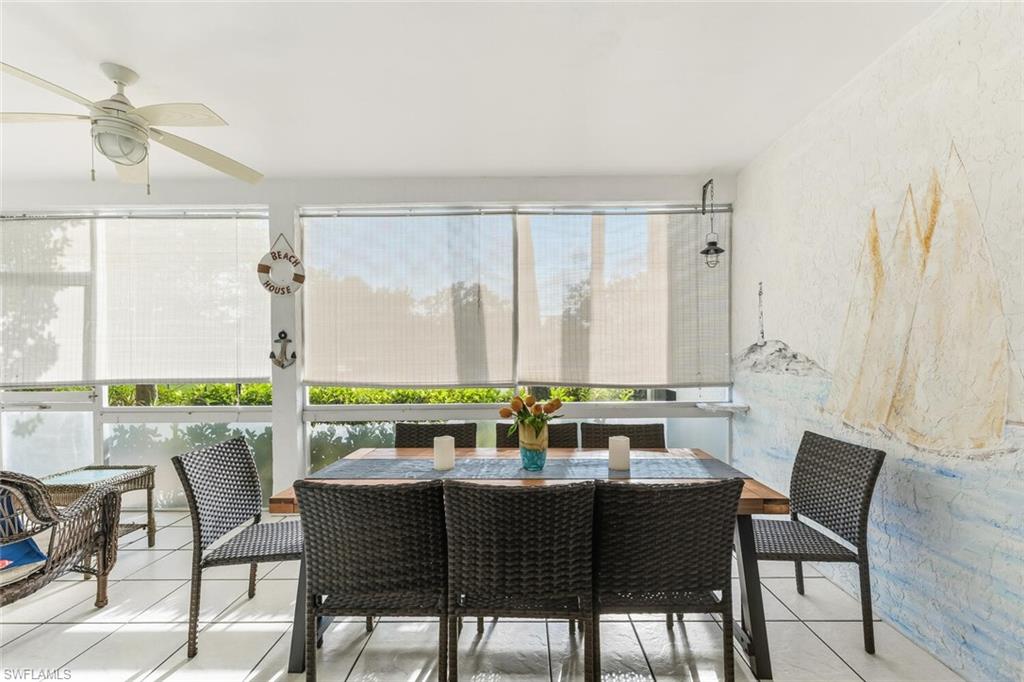 Undisclosed Address Naples, FL 34113 - Photo 10 of 24 a view of a dining room with furniture window and outside view