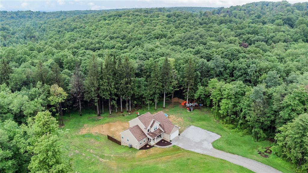 216 Saylor Road Dunbar, PA 15431 - Photo 2 of 25 a view of a backyard with table and chairs