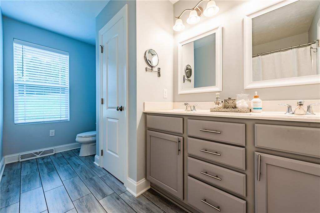 216 Saylor Road Dunbar, PA 15431 - Photo 16 of 25 a bathroom with a sink mirror and toilet