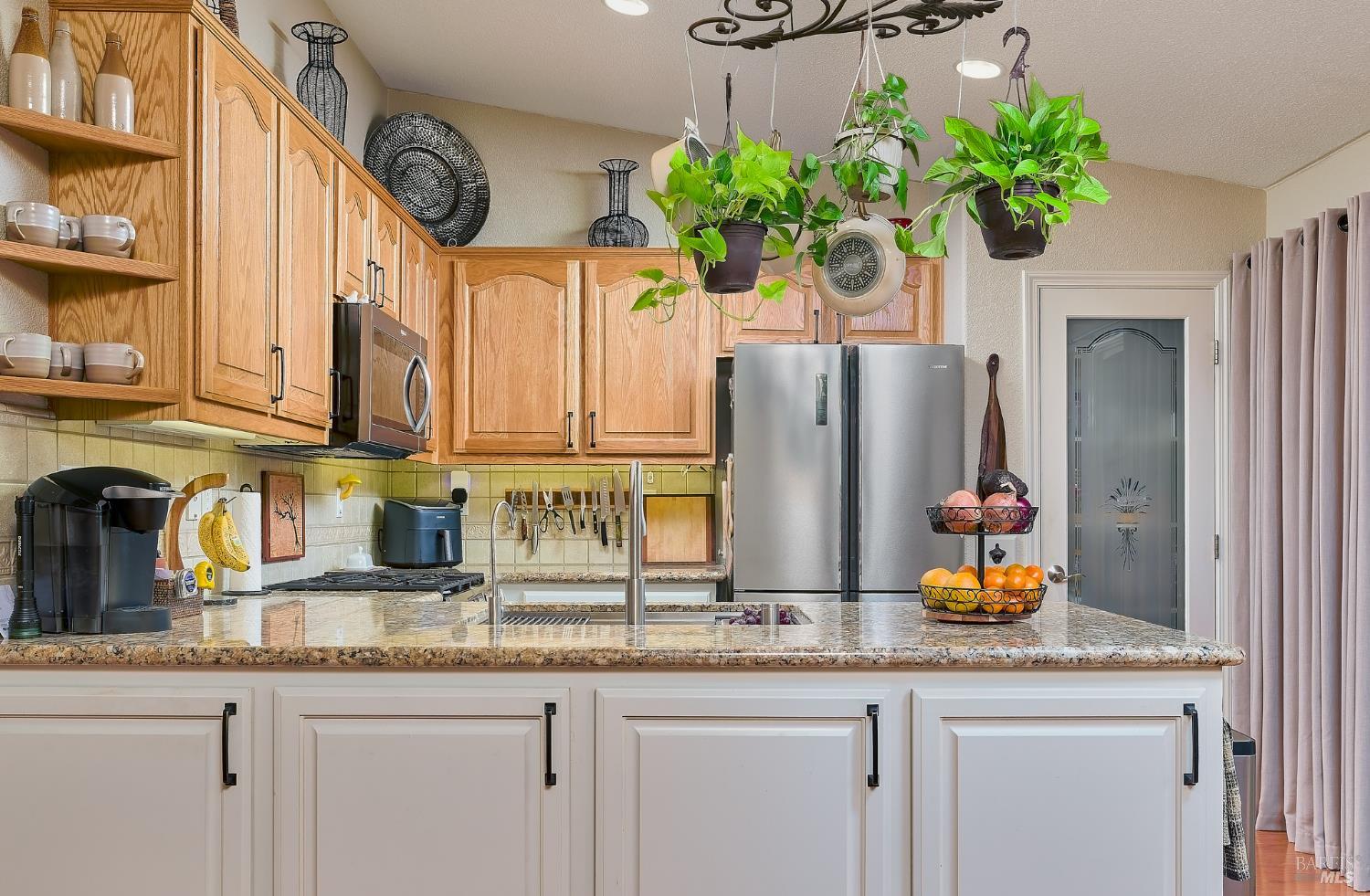 402 Riverwood Lane Rio Vista, CA 94571 - Photo 15 of 31 a kitchen with stainless steel appliances granite countertop a sink a potted plant and a window
