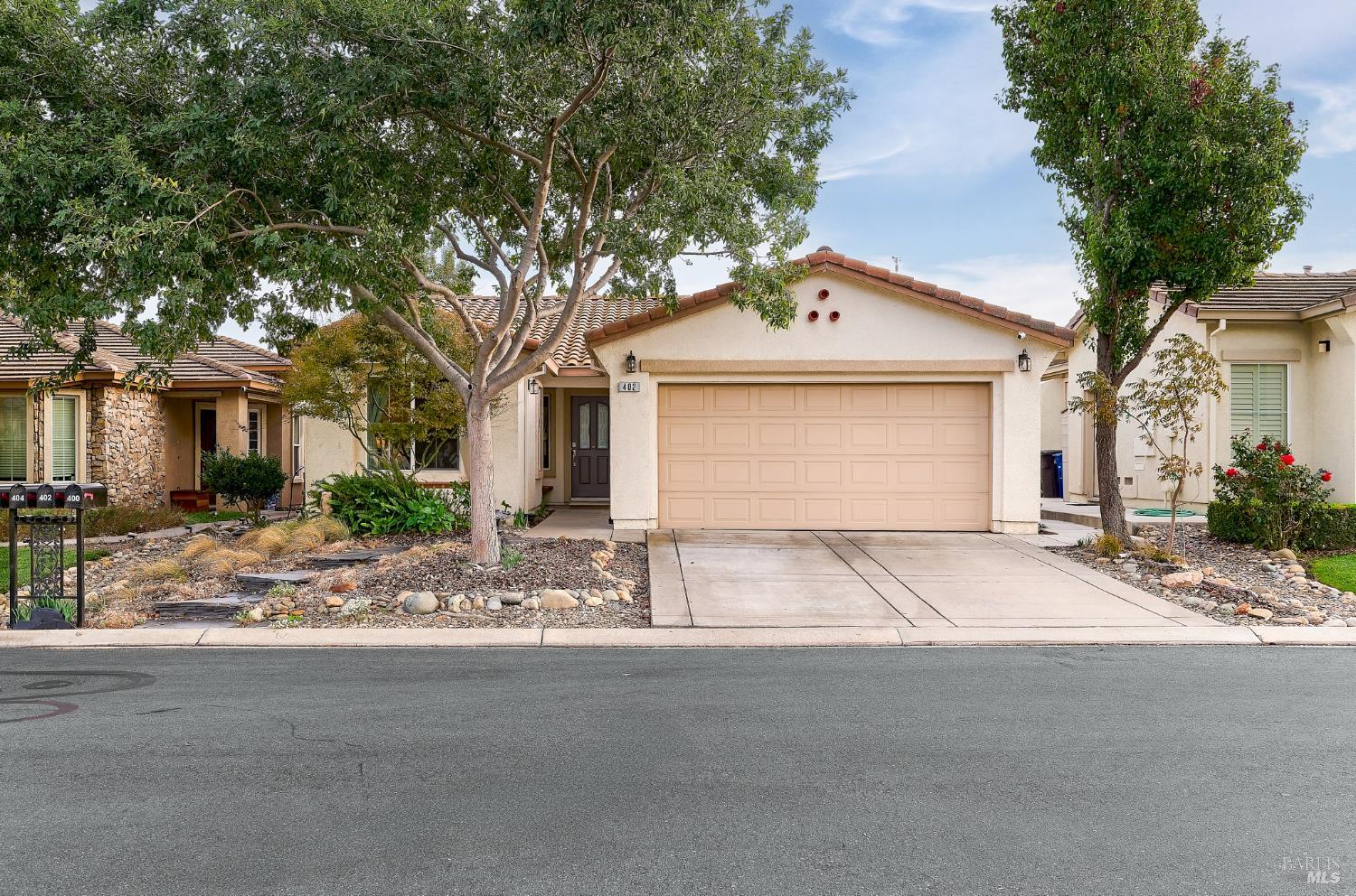 402 Riverwood Lane Rio Vista, CA 94571 - Photo 2 of 31 a front view of a house with yard and trees