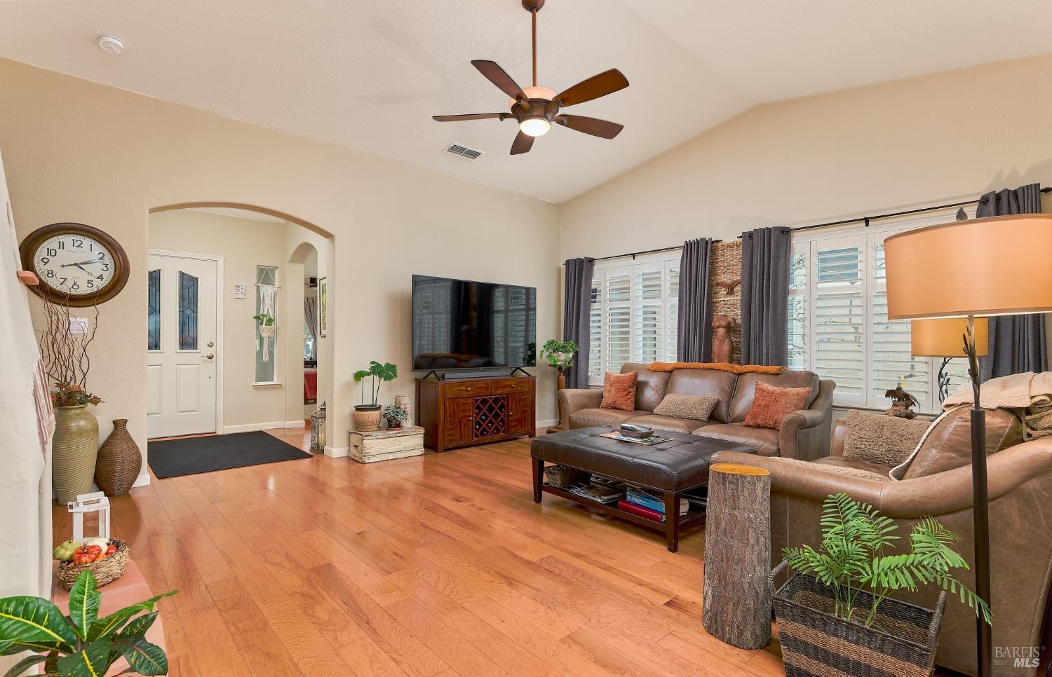402 Riverwood Lane Rio Vista, CA 94571 - Photo 9 of 31 a living room with furniture a flat screen tv and a large window