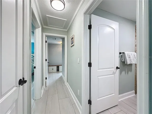 a living room with furniture and a view of kitchen