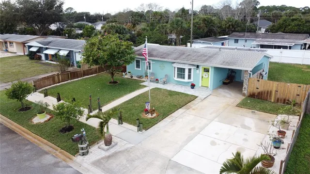 an aerial view of a house with a garden