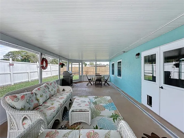a view of a house with backyard and porch