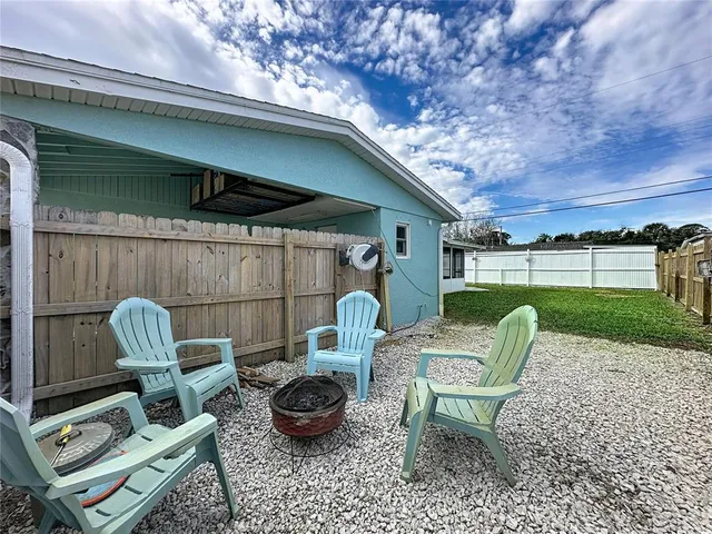 an aerial view of a residential houses with outdoor space and street view