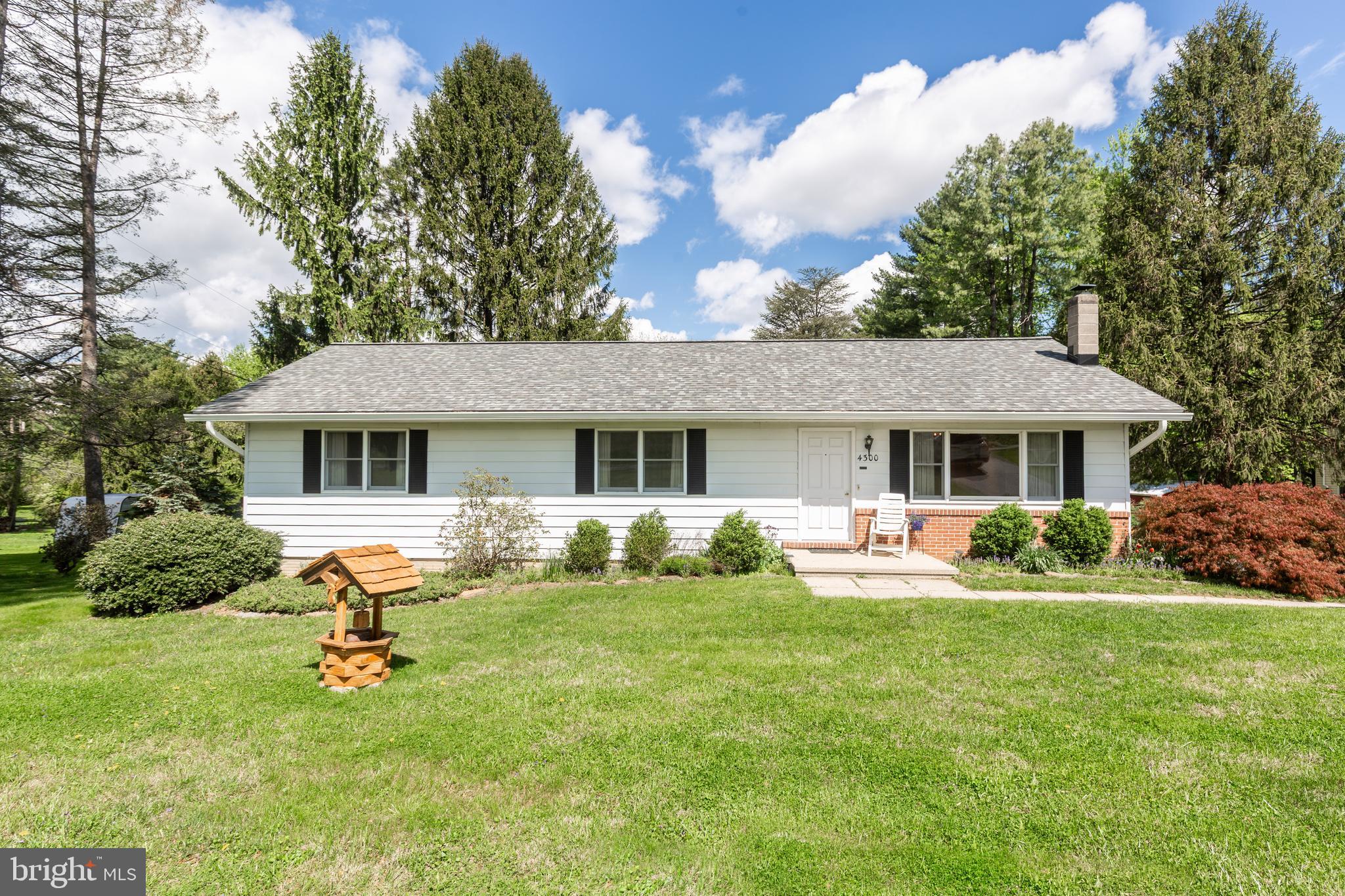 4300 Maple Grove Road Hampstead, MD 21074 - Photo 1 of 58 a front view of a house with a yard table and chairs