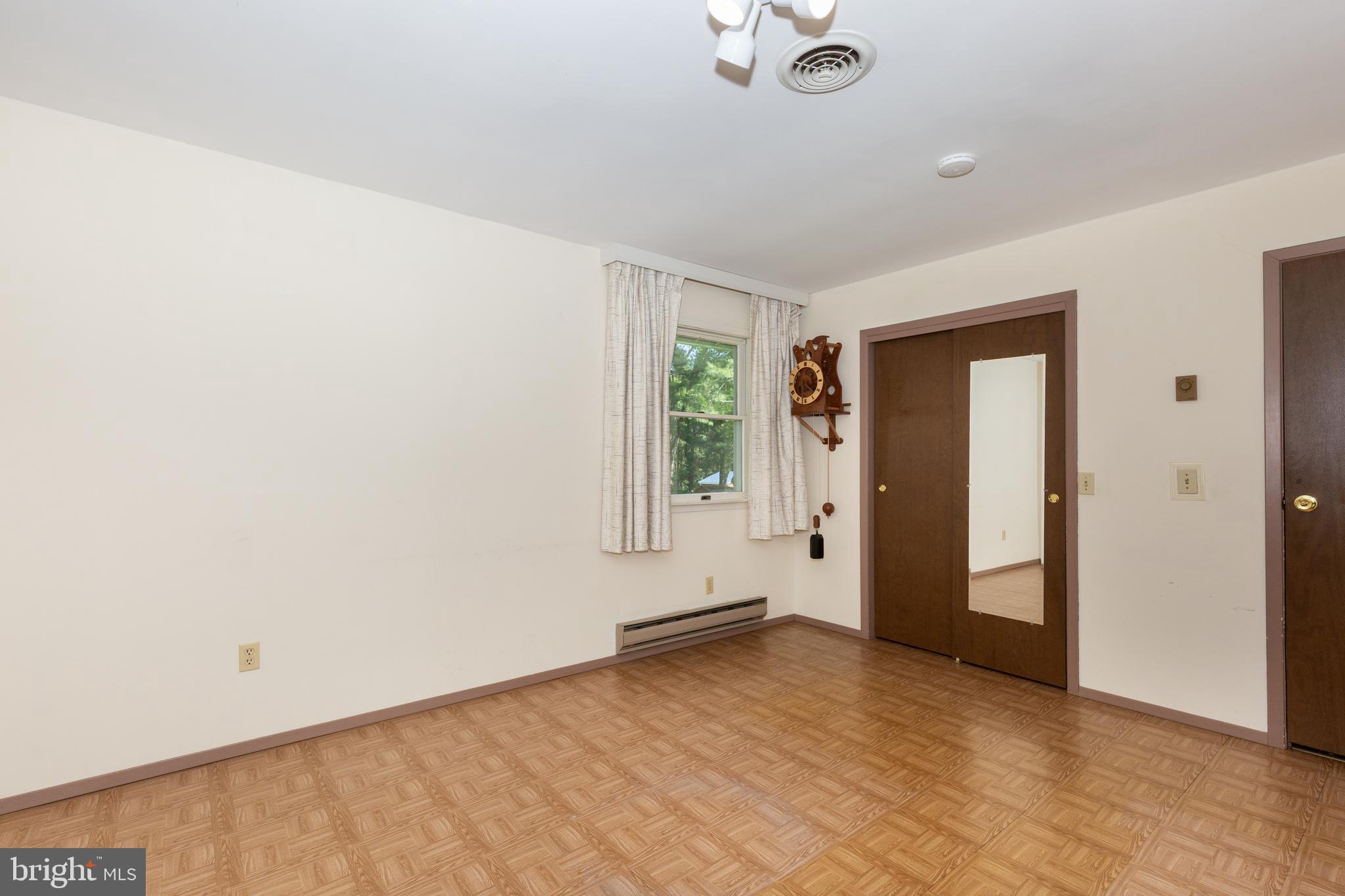 4300 Maple Grove Road Hampstead, MD 21074 - Photo 17 of 58 an empty room with a empty space and windows