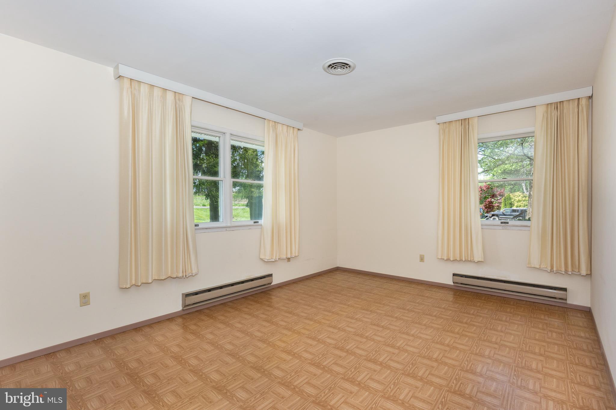 4300 Maple Grove Road Hampstead, MD 21074 - Photo 21 of 58 an empty room with wooden floor and windows