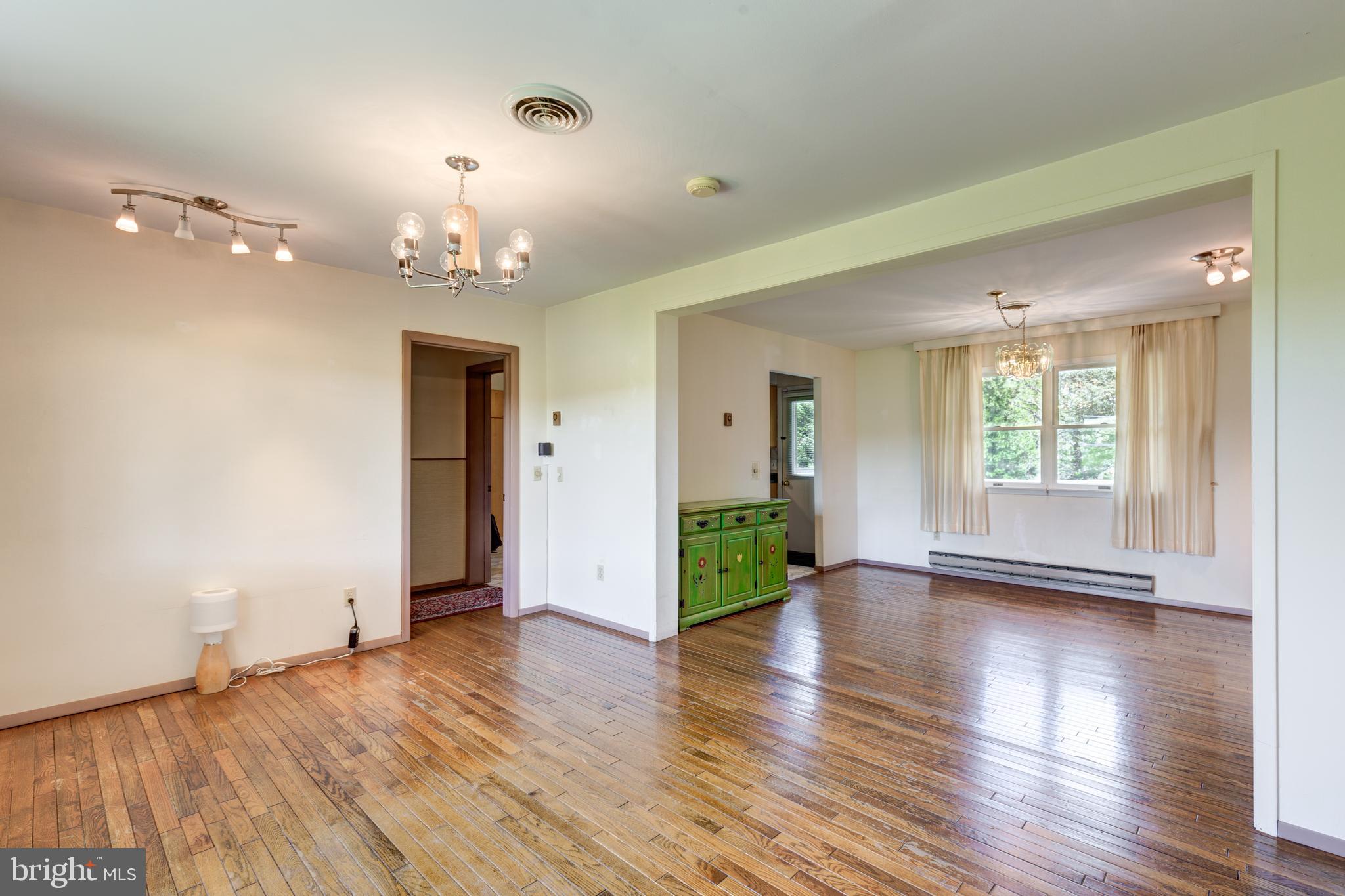4300 Maple Grove Road Hampstead, MD 21074 - Photo 5 of 58 a view of an empty room with window and wooden floor
