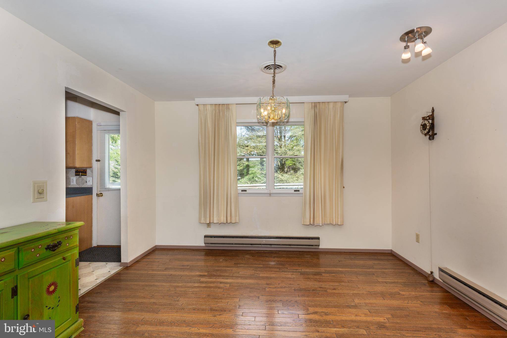 4300 Maple Grove Road Hampstead, MD 21074 - Photo 7 of 58 wooden floor in an empty room with a window