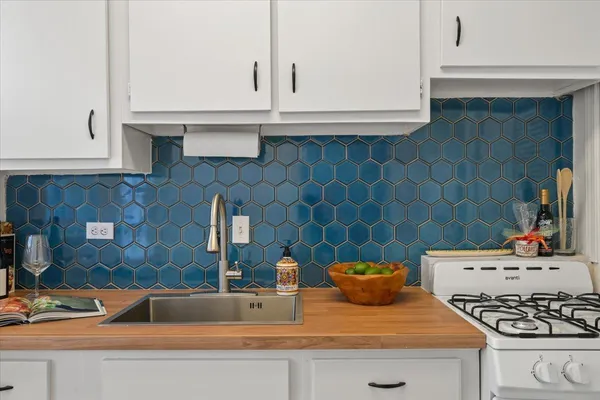 a kitchen with a sink and a stove