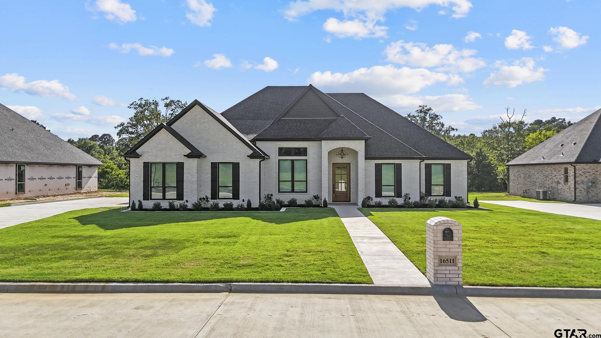 16511 Cooper Way Flint, TX 75762 - Photo 1 of 44 a front view of a house with swimming pool having outdoor seating
