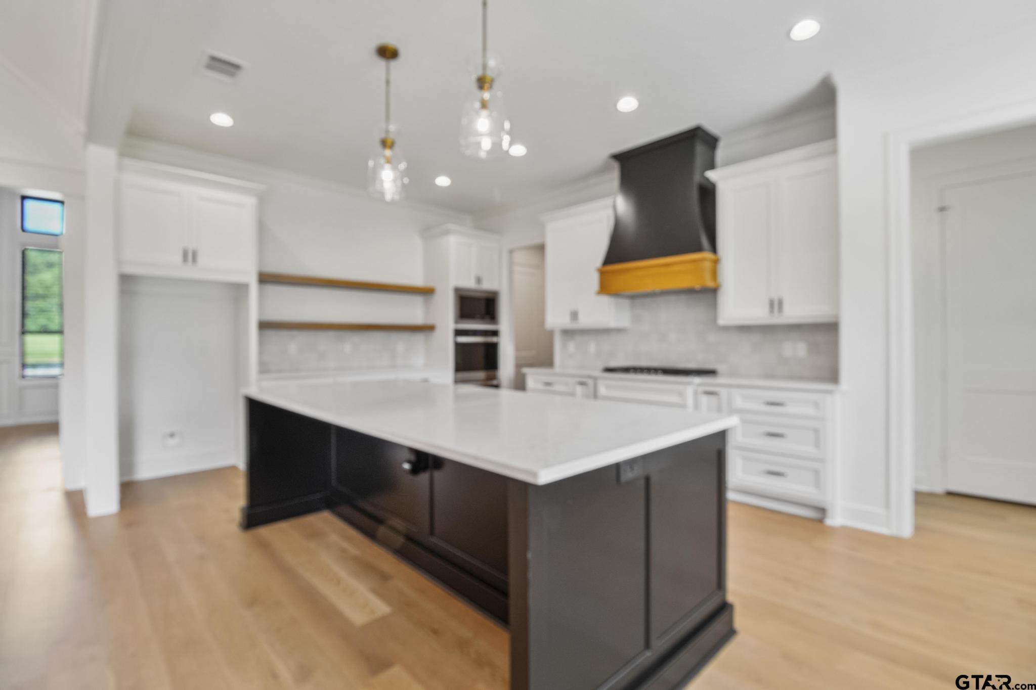 16511 Cooper Way Flint, TX 75762 - Photo 13 of 44 a kitchen with a sink a stove a refrigerator and cabinets