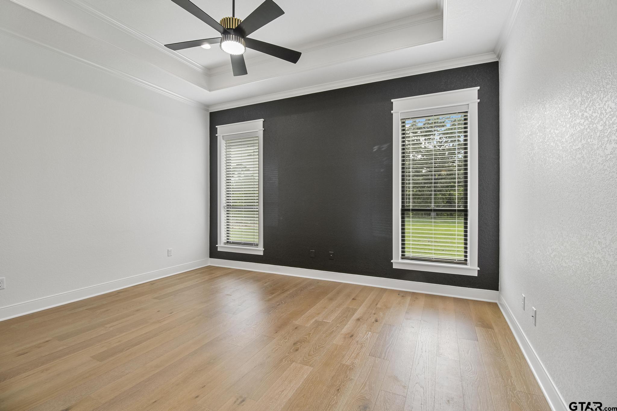16511 Cooper Way Flint, TX 75762 - Photo 21 of 44 an empty room with wooden floor fan and windows