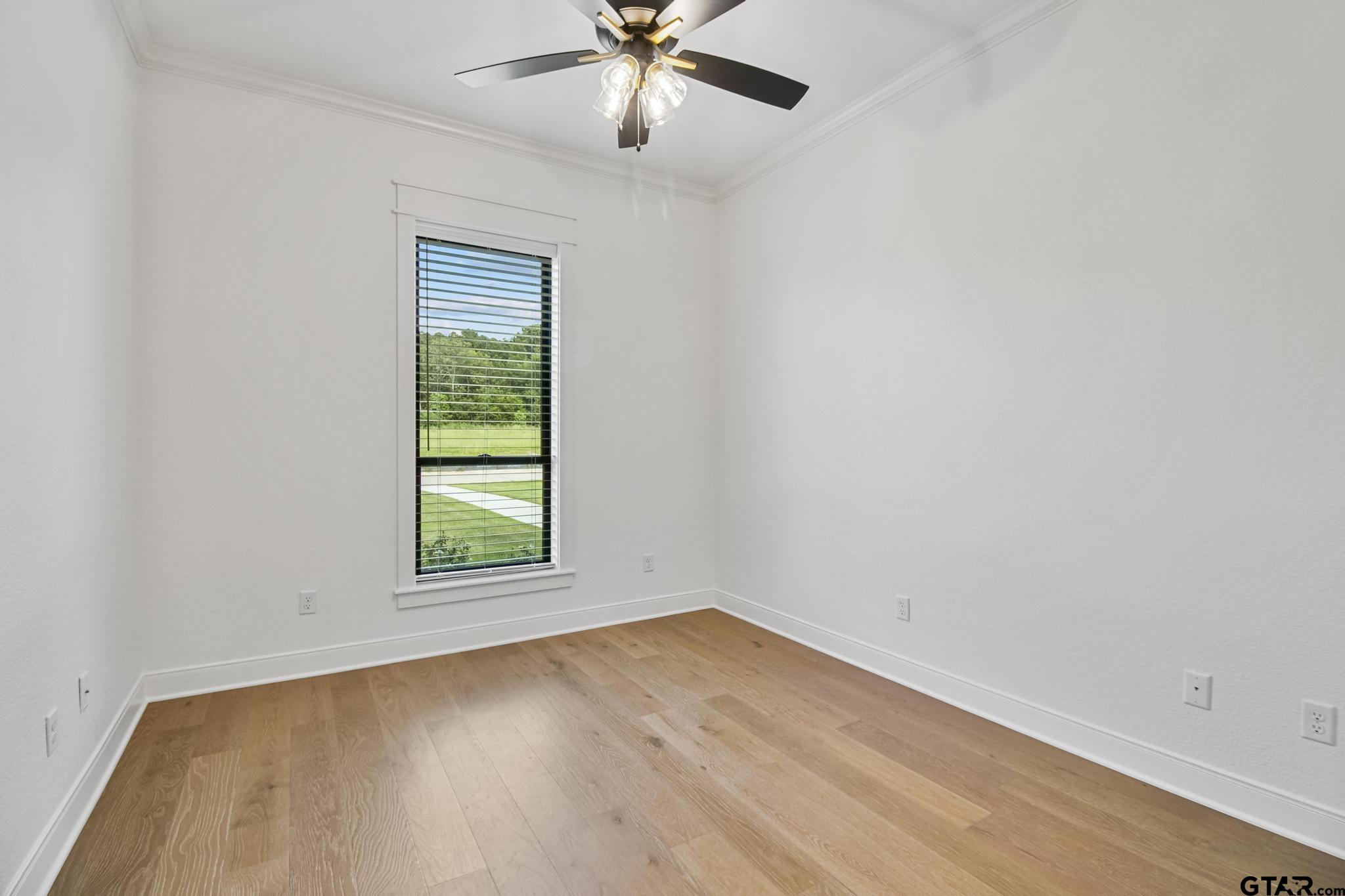16511 Cooper Way Flint, TX 75762 - Photo 29 of 44 an empty room with a window and ceiling fan
