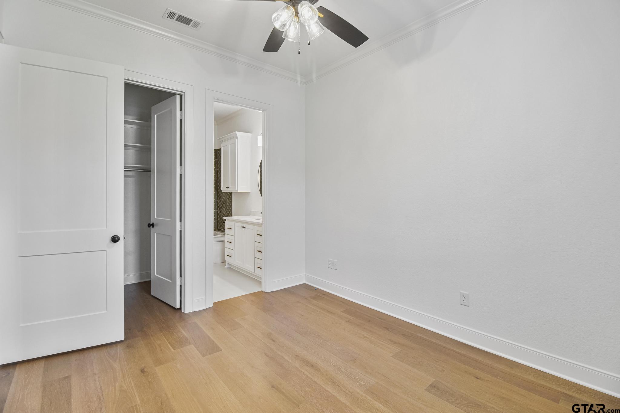 16511 Cooper Way Flint, TX 75762 - Photo 33 of 44 an empty room with a hardwood and ceiling fan