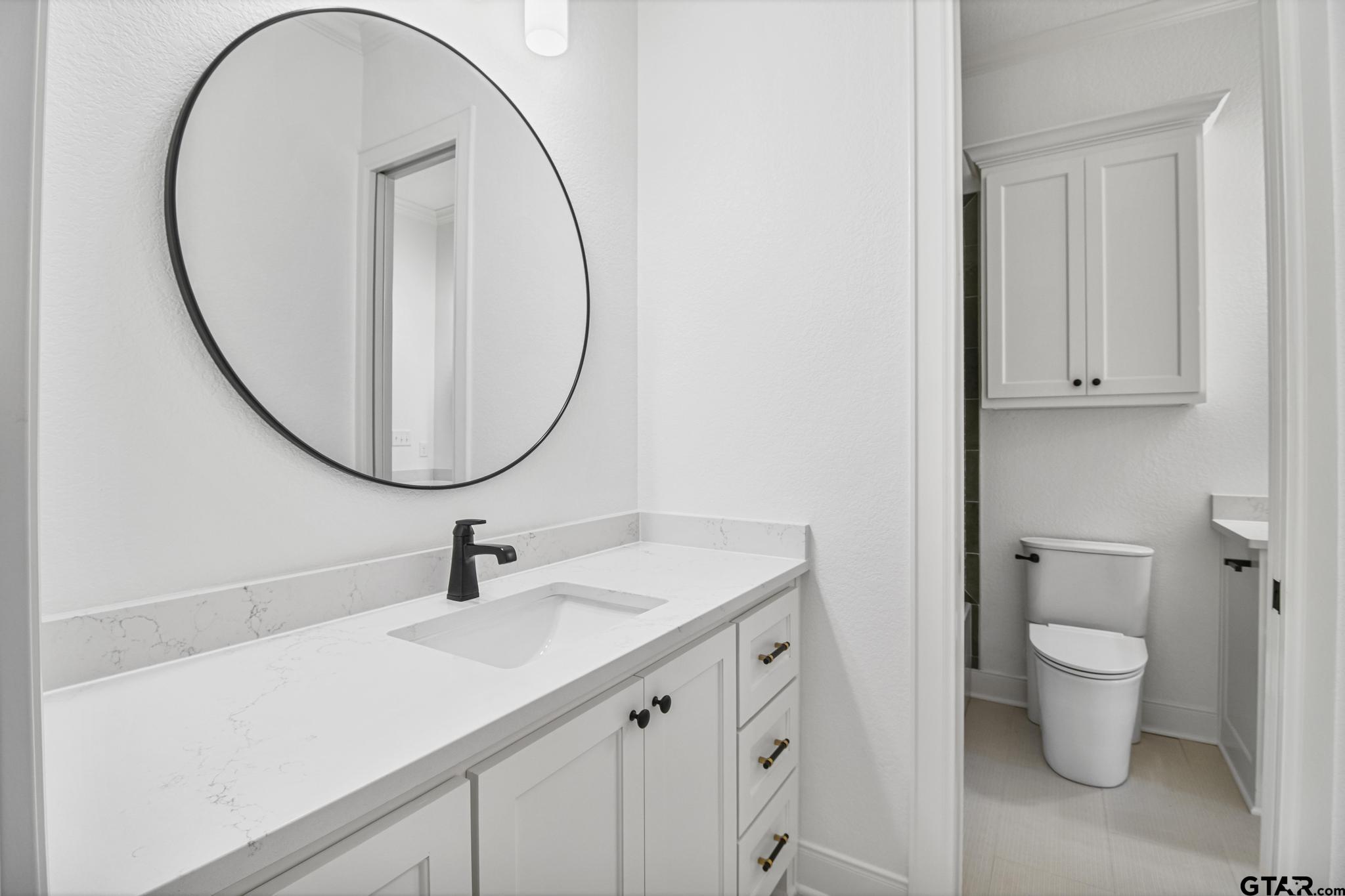 16511 Cooper Way Flint, TX 75762 - Photo 35 of 44 a bathroom with a sink and a mirror