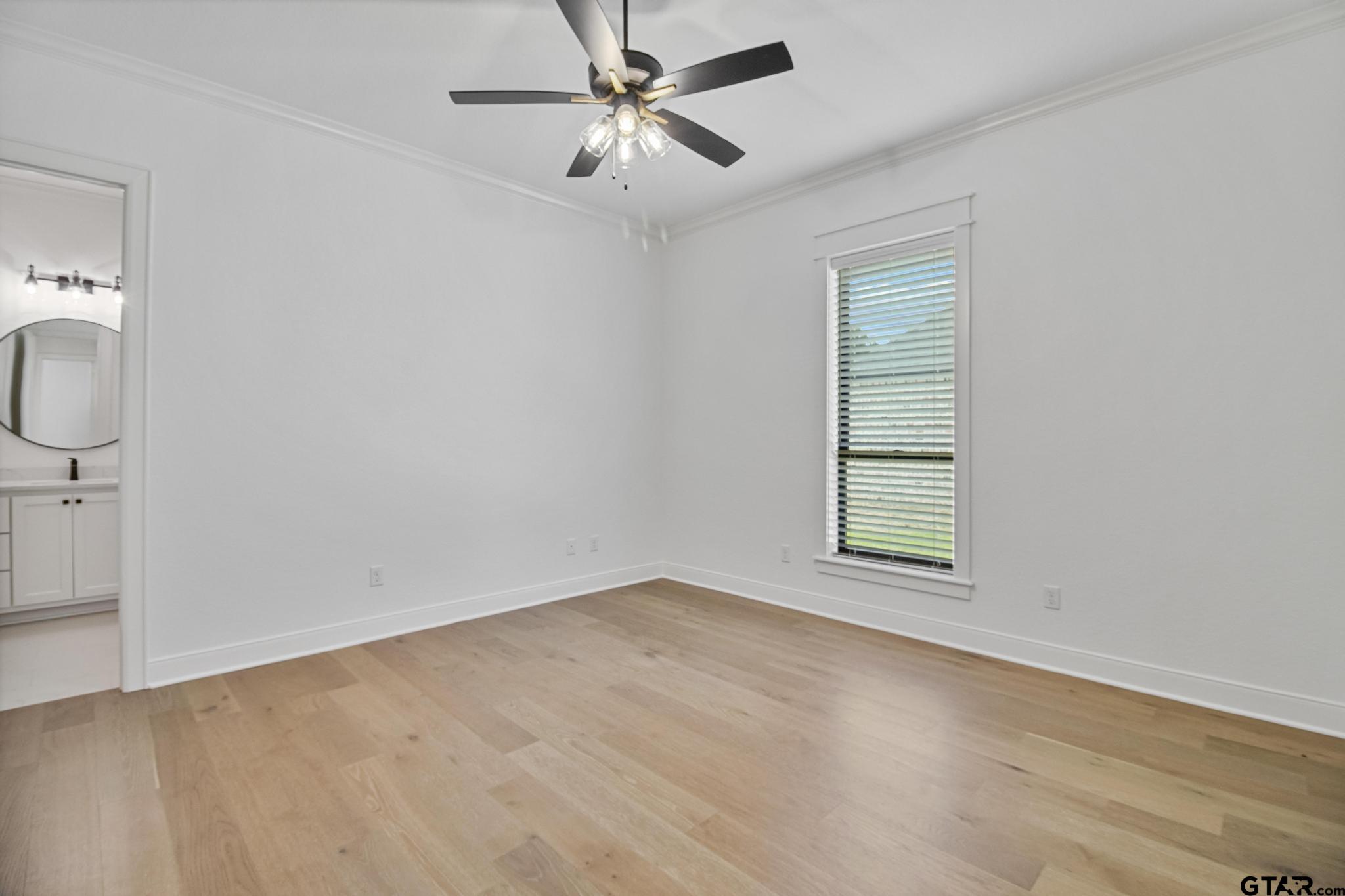 16511 Cooper Way Flint, TX 75762 - Photo 36 of 44 an empty room with windows and fan