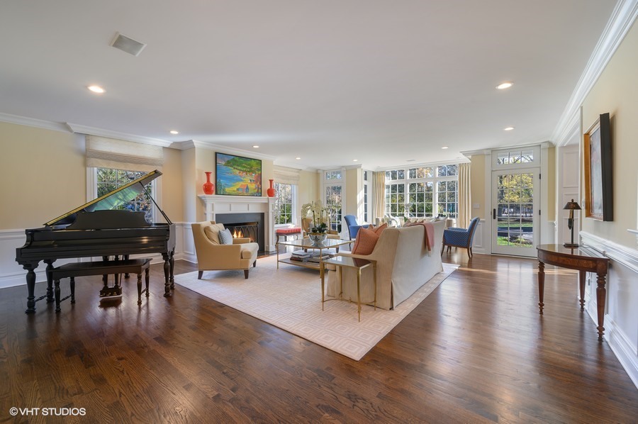 29 Woodley Road Winnetka, IL 60093 - Photo 12 of 65 a living room with fireplace furniture and a wooden floor