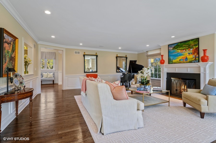 29 Woodley Road Winnetka, IL 60093 - Photo 13 of 65 a living room with furniture a fireplace and a flat screen tv