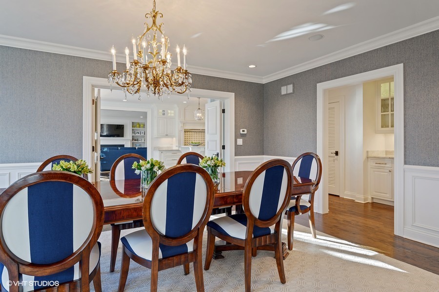 29 Woodley Road Winnetka, IL 60093 - Photo 15 of 65 a dining room with furniture a chandelier and wooden floor