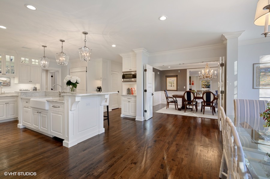 29 Woodley Road Winnetka, IL 60093 - Photo 18 of 65 a large white kitchen with lots of counter space and furniture