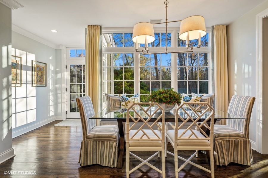 29 Woodley Road Winnetka, IL 60093 - Photo 24 of 65 a view of a dining room with furniture wooden floor and windows