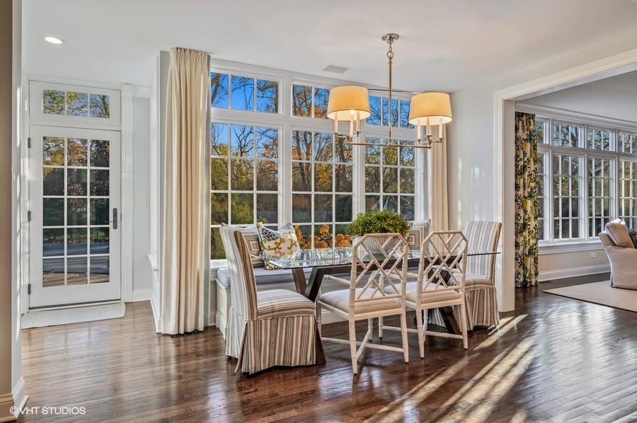 29 Woodley Road Winnetka, IL 60093 - Photo 25 of 65 a view of a dining room with furniture window and wooden floor