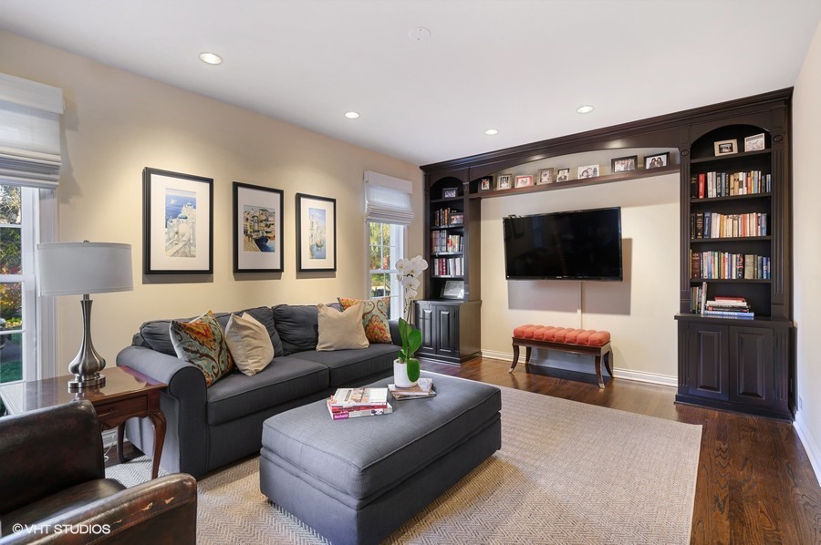 29 Woodley Road Winnetka, IL 60093 - Photo 33 of 65 a living room with furniture and a flat screen tv