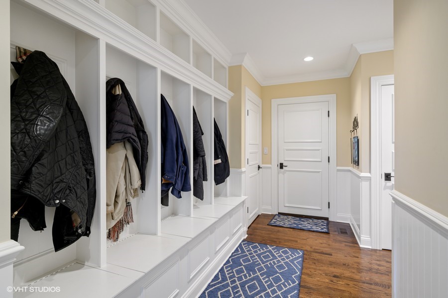 29 Woodley Road Winnetka, IL 60093 - Photo 36 of 65 a view of walk in closet with clothes and shoes