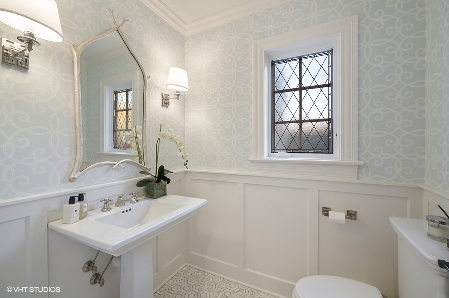 29 Woodley Road Winnetka, IL 60093 - Photo 37 of 65 a bathroom with a sink toilet and mirror