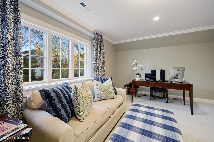 29 Woodley Road Winnetka, IL 60093 - Photo 49 of 65 a living room with furniture and a window