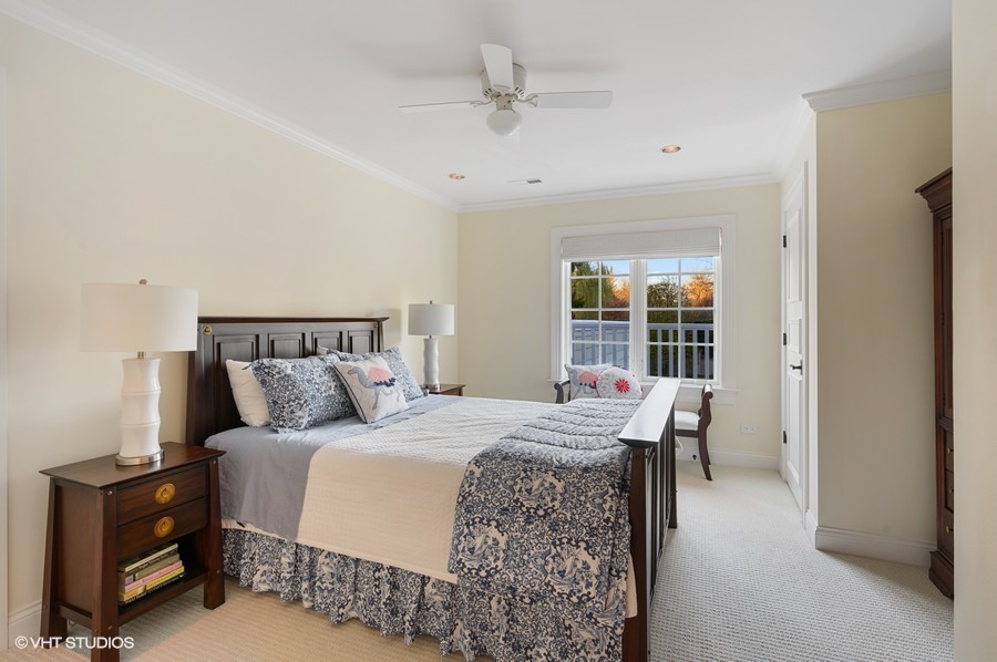 29 Woodley Road Winnetka, IL 60093 - Photo 54 of 65 a bedroom with a bed and a window