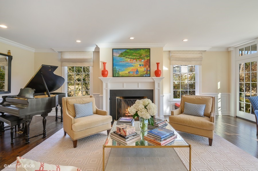 29 Woodley Road Winnetka, IL 60093 - Photo 9 of 65 a living room with furniture and a fireplace