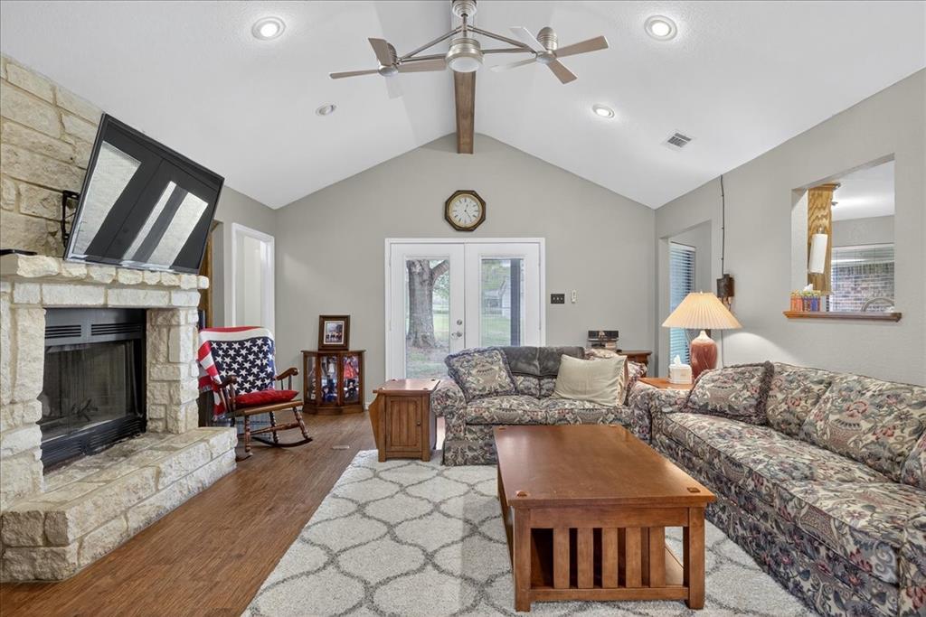 a living room with furniture fireplace and window