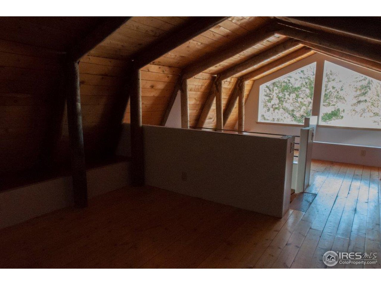 229 Jed Smith Road Ward, CO 80481 - Photo 11 of 20 a living room with wooden floor