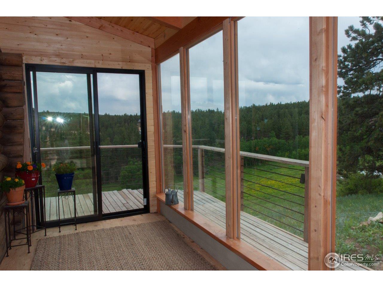 229 Jed Smith Road Ward, CO 80481 - Photo 2 of 20 a house view with a outdoor space
