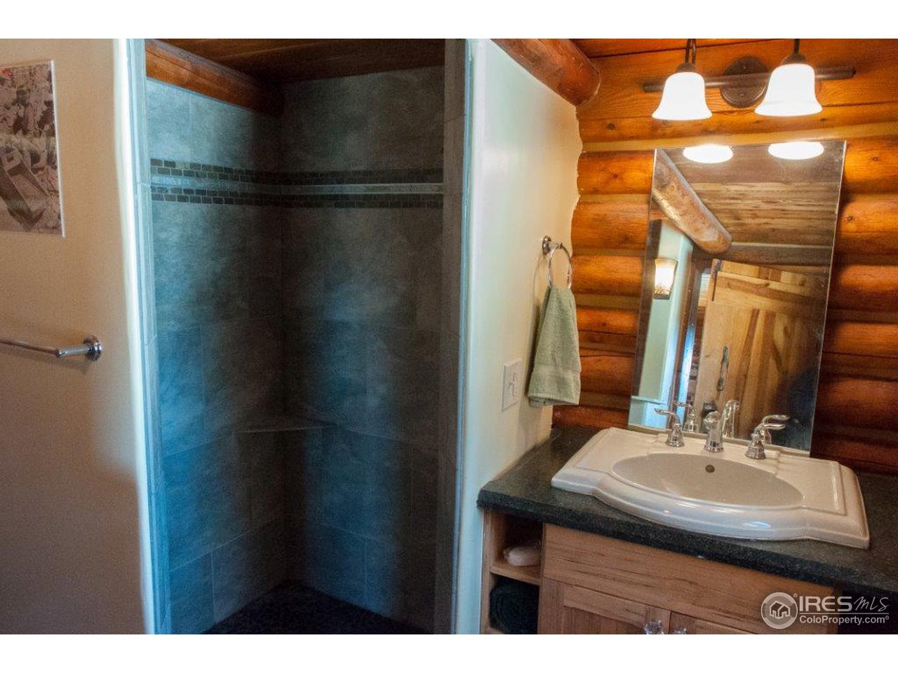 229 Jed Smith Road Ward, CO 80481 - Photo 7 of 20 a bathroom with a sink and mirror