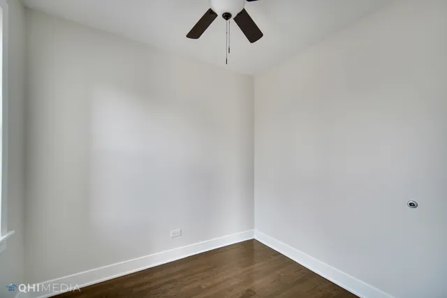 a view of a small space with wooden floor