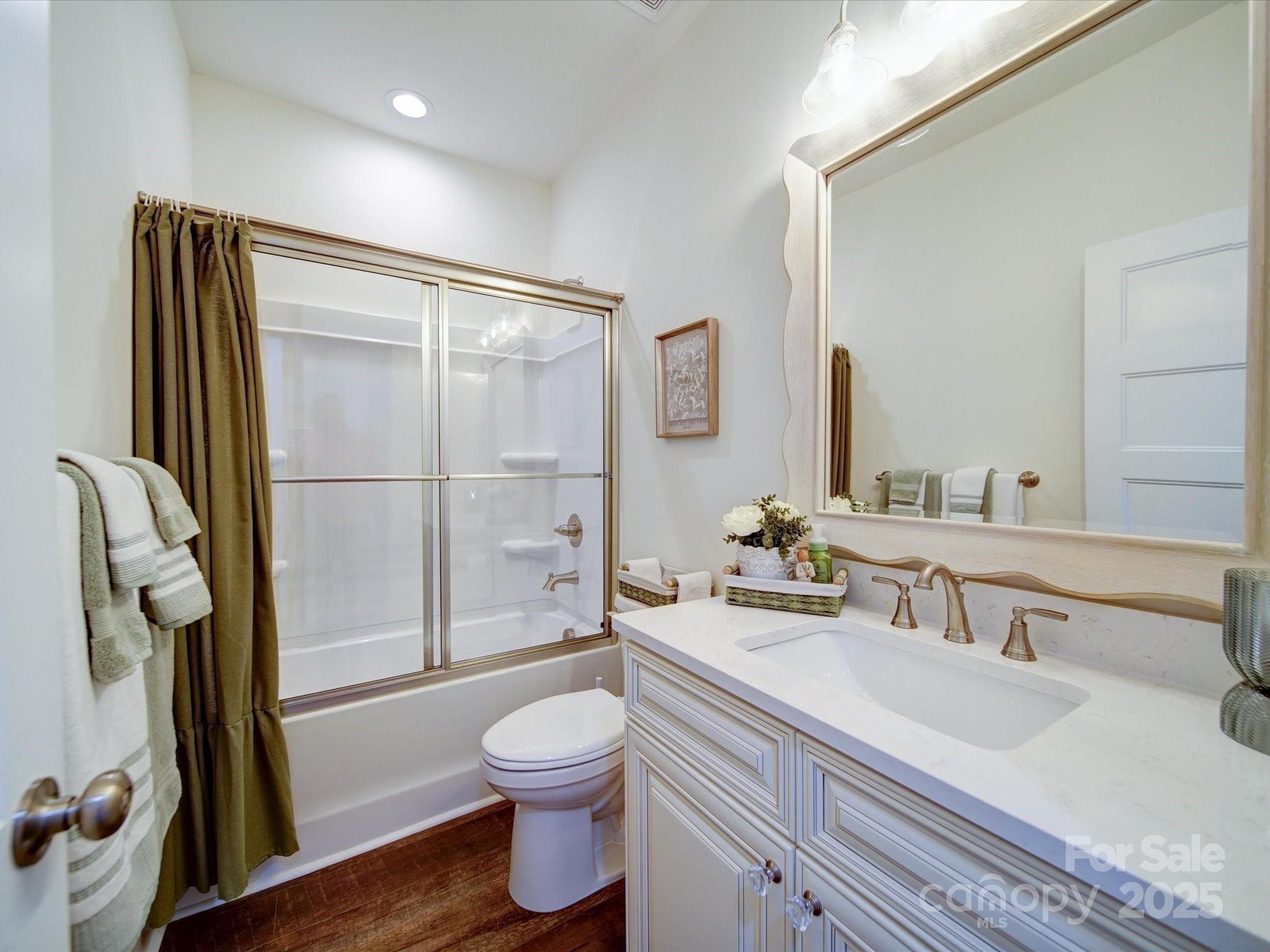 1026 Trull Hinson Road, Unit 4 Wingate, NC 28174 - Photo 14 of 14 a bathroom with a sink a toilet and shower