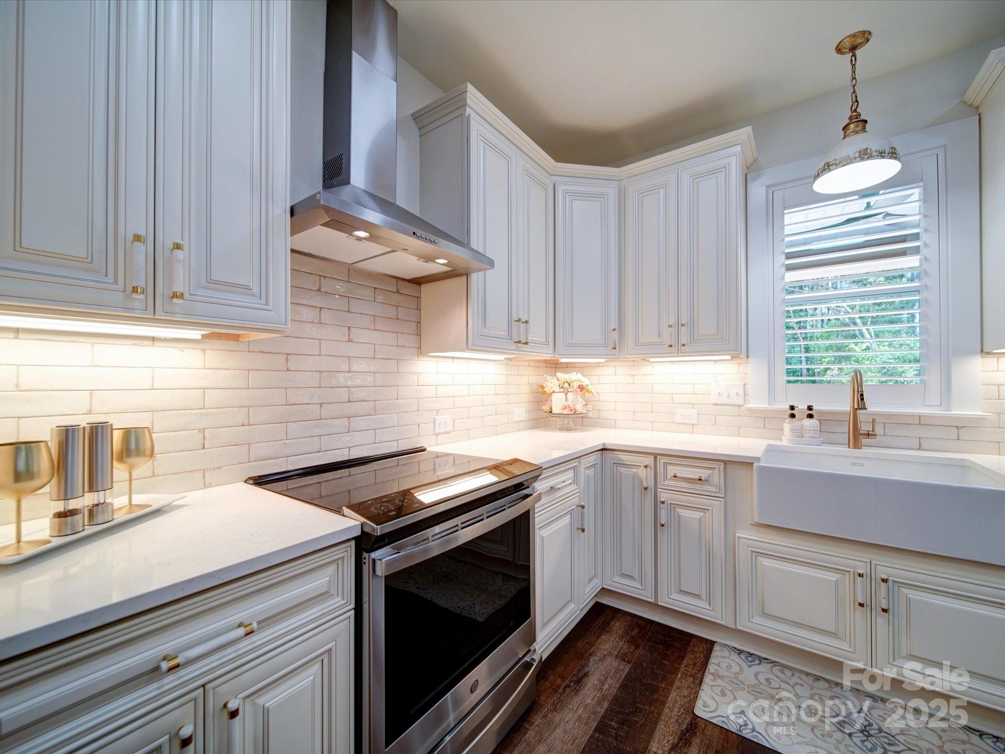 1026 Trull Hinson Road, Unit 4 Wingate, NC 28174 - Photo 2 of 14 a kitchen with granite countertop a sink stainless steel appliances and cabinets