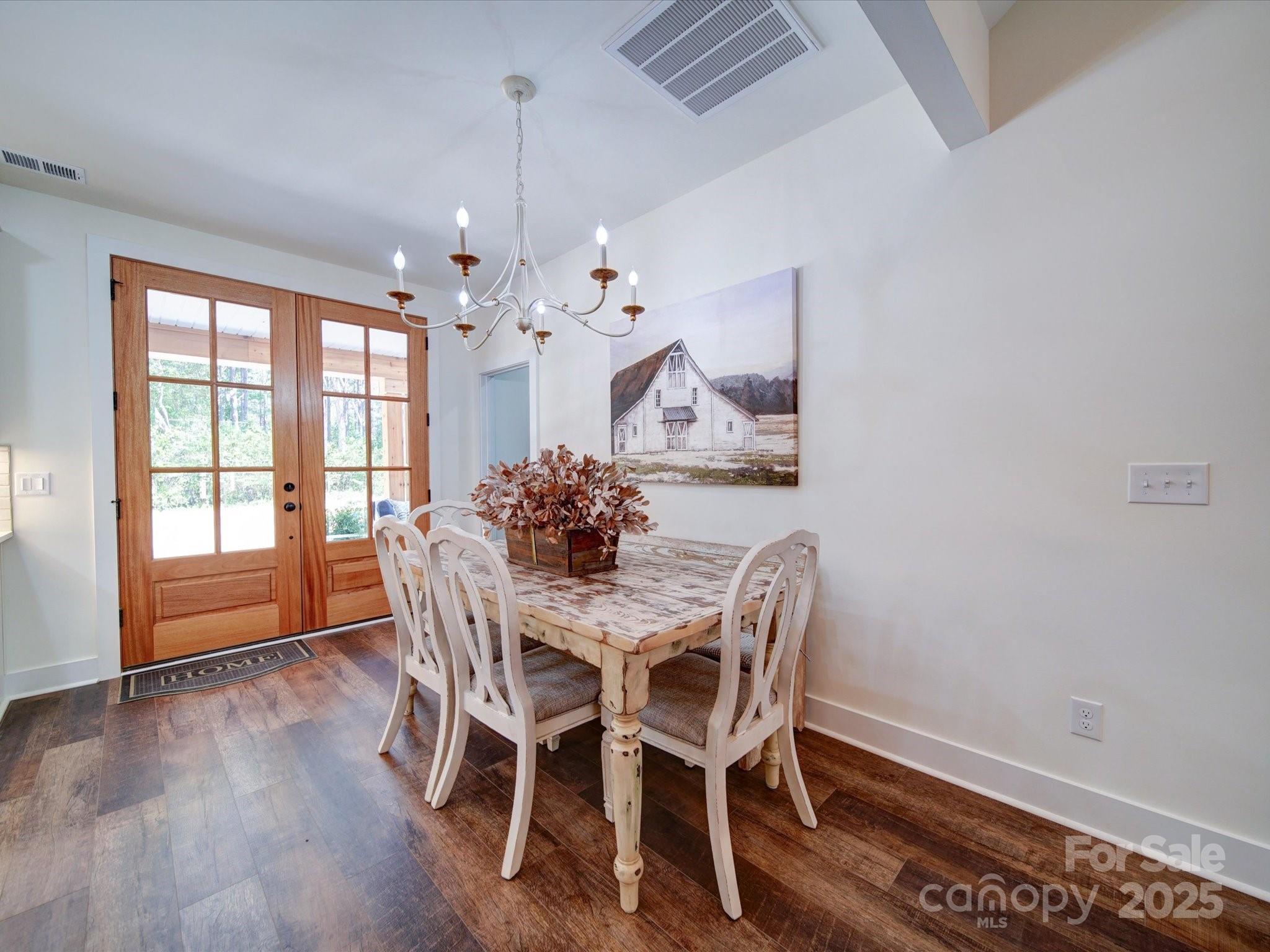1026 Trull Hinson Road, Unit 4 Wingate, NC 28174 - Photo 8 of 14 a view of a dining room with furniture window and wooden floor