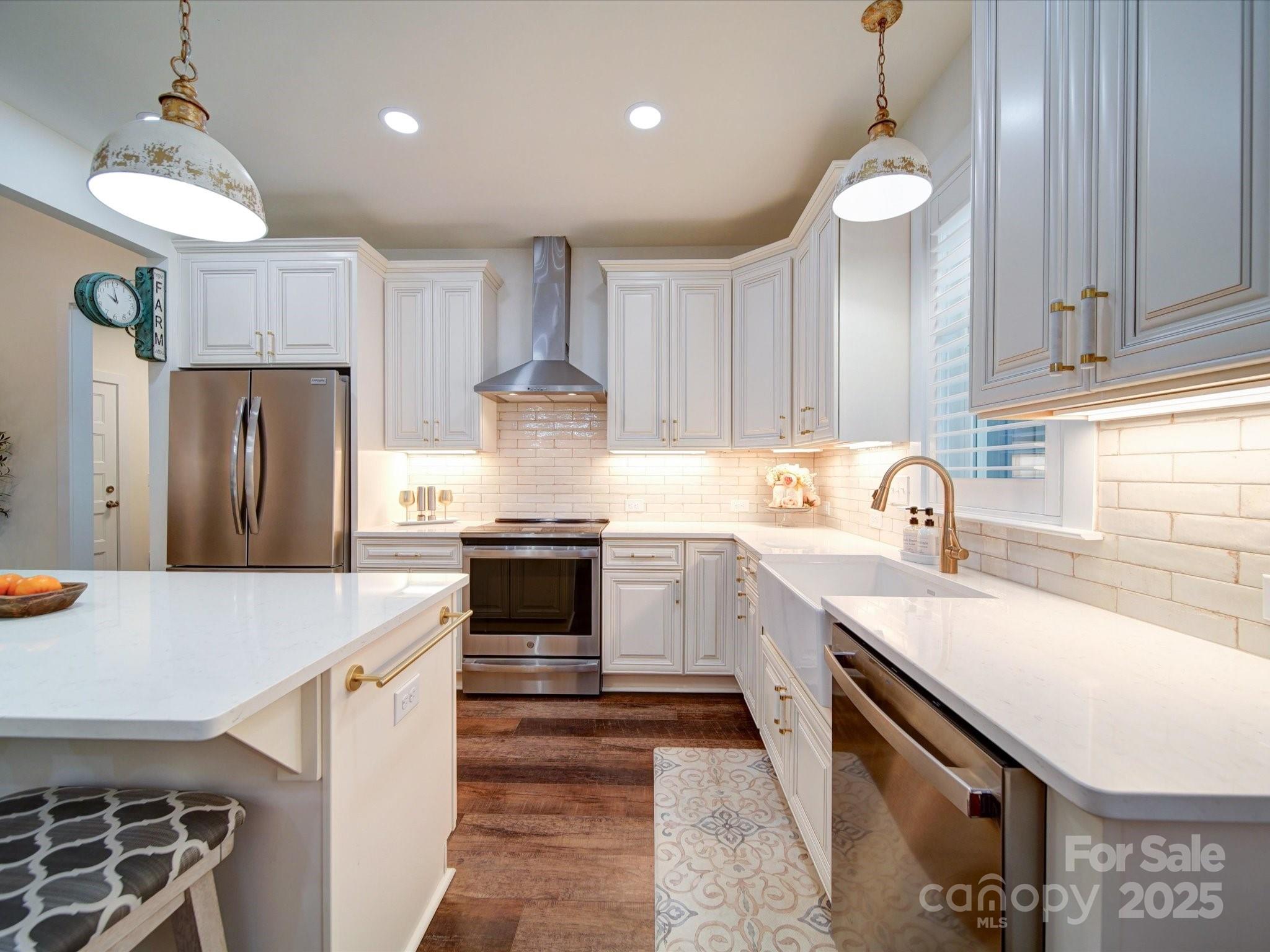 1026 Trull Hinson Road, Unit 4 Wingate, NC 28174 - Photo 9 of 14 a kitchen with stainless steel appliances granite countertop a sink stove and refrigerator