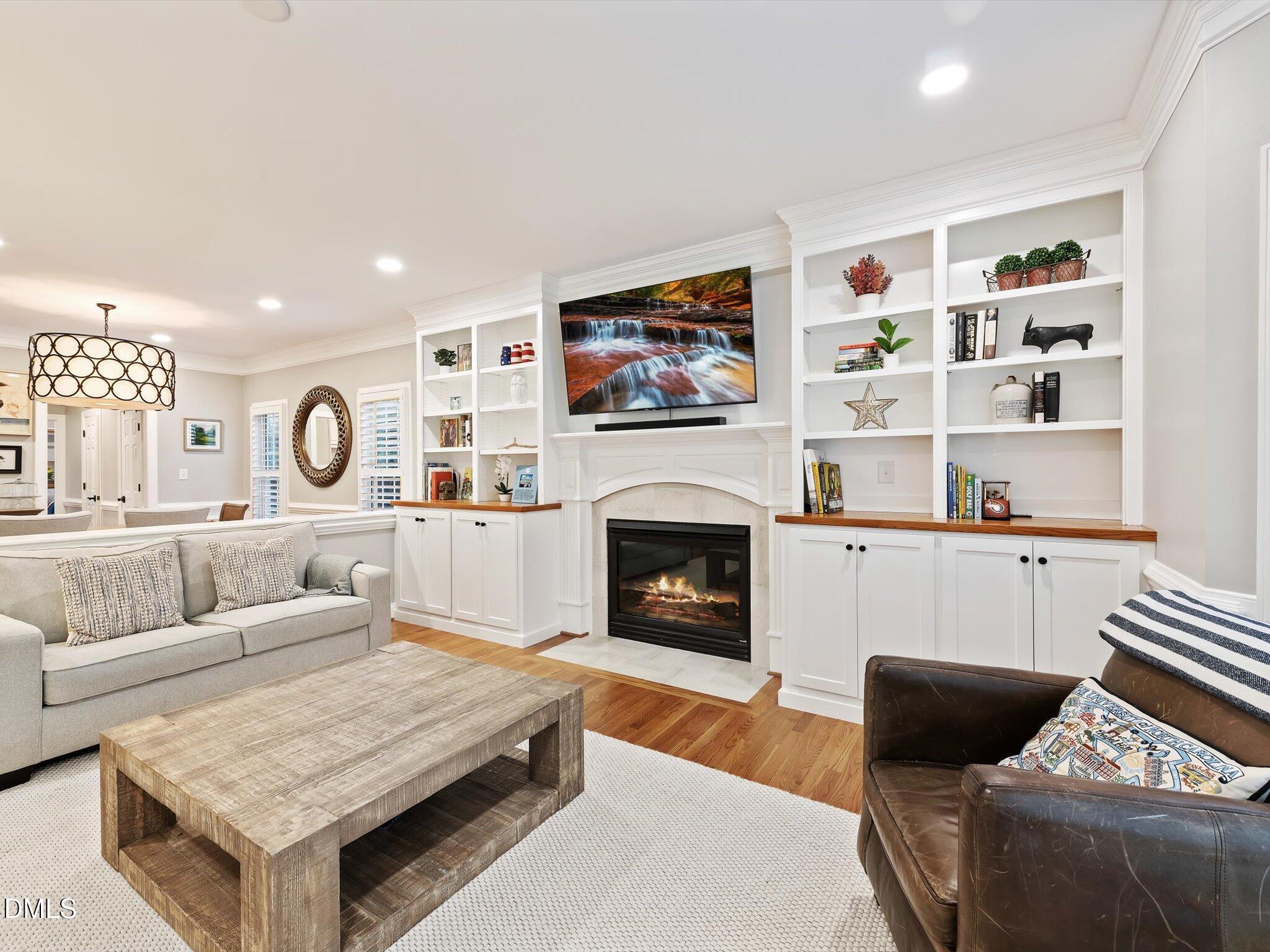 4201 Falls River Avenue Raleigh, NC 27614 - Photo 12 of 52 a living room with furniture and a fireplace
