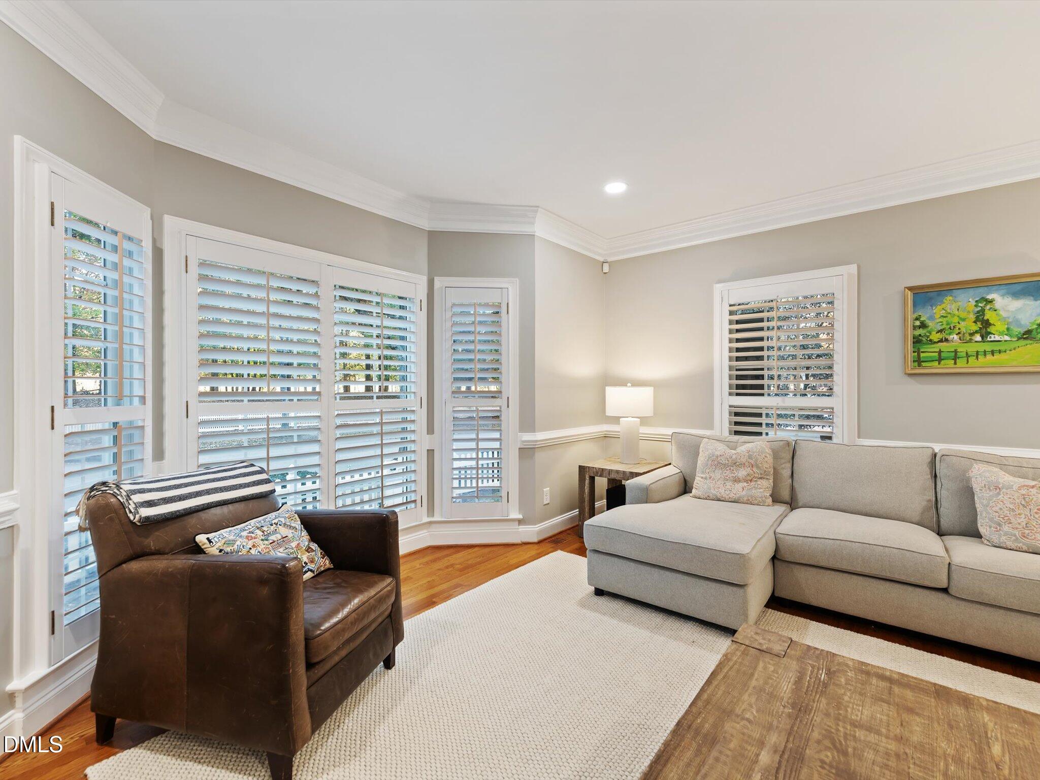 4201 Falls River Avenue Raleigh, NC 27614 - Photo 13 of 52 a living room with furniture and a large window