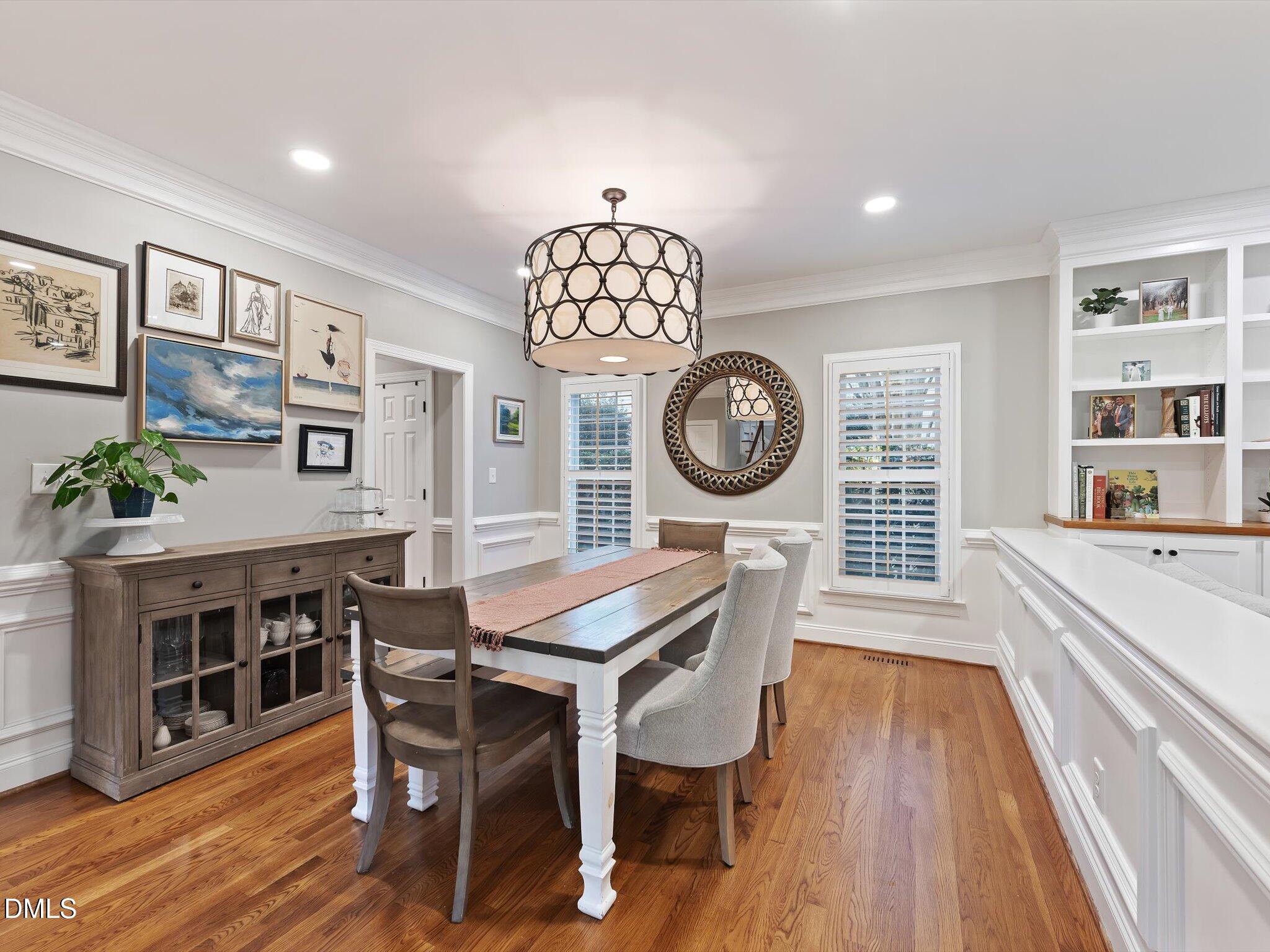 4201 Falls River Avenue Raleigh, NC 27614 - Photo 15 of 52 a view of a dining room with furniture and wooden floor