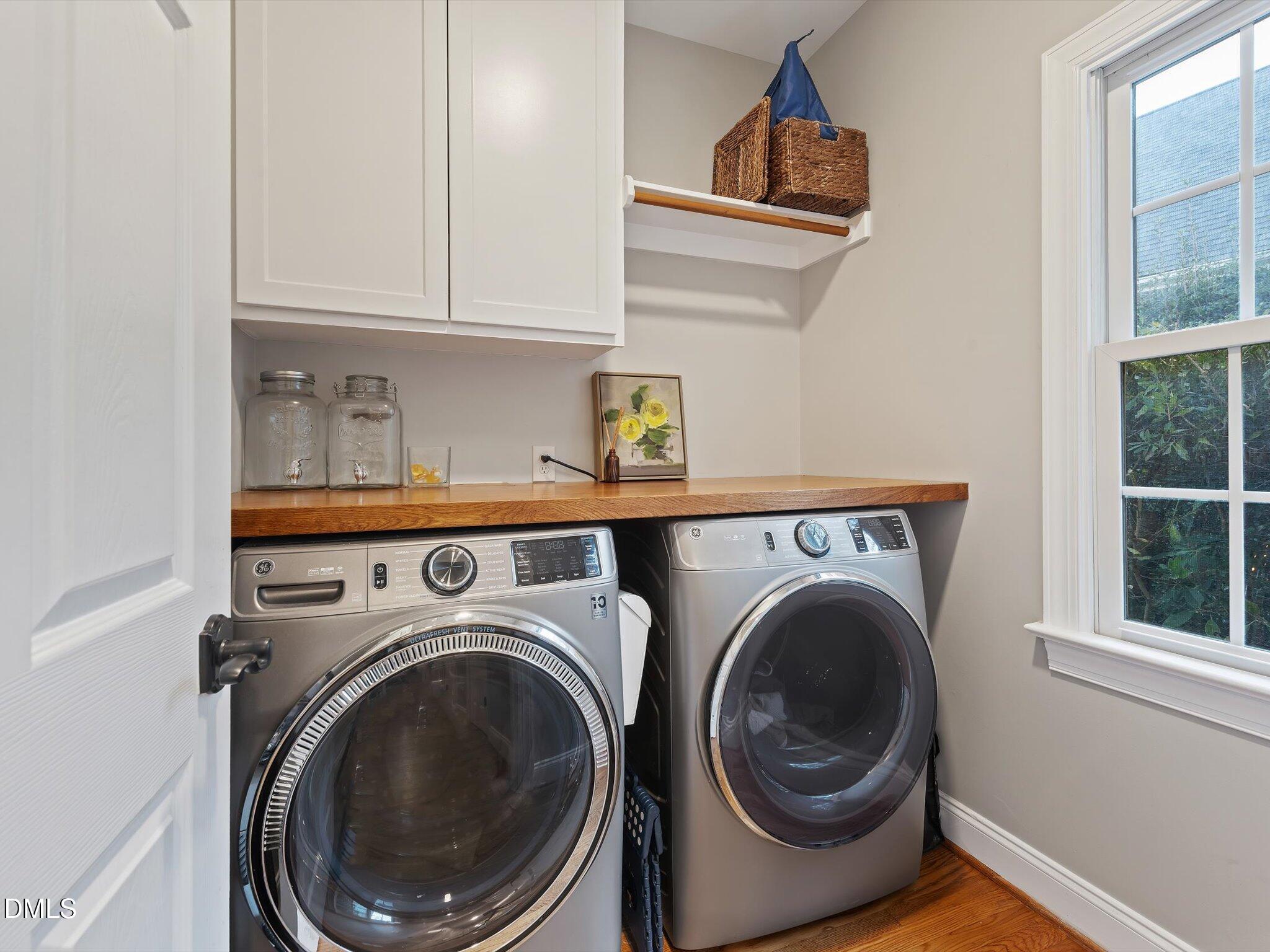 4201 Falls River Avenue Raleigh, NC 27614 - Photo 24 of 52 a utility room with dryer and washer